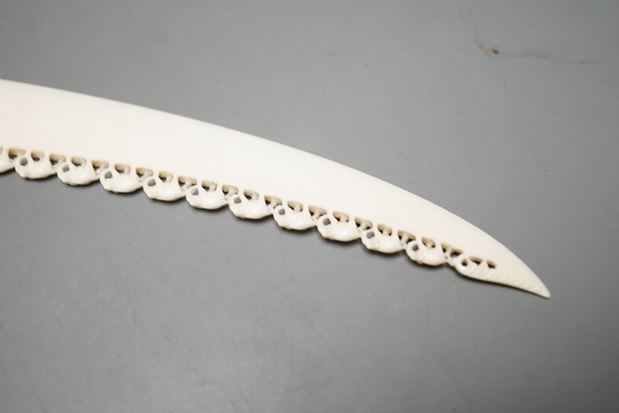 An Indian ivory letter opener, 38cm, and a Ganesh figure